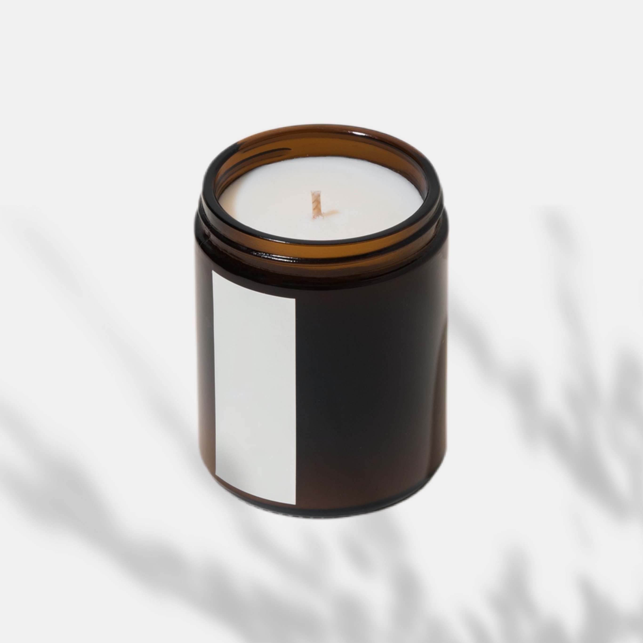 A candle on a white background with a shadow magic template