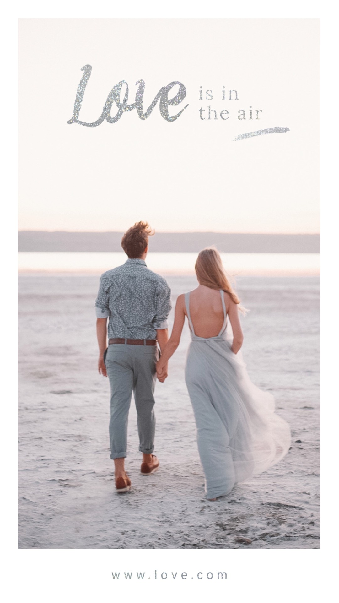 Man and woman holding hands while walking on the beach Love Story template