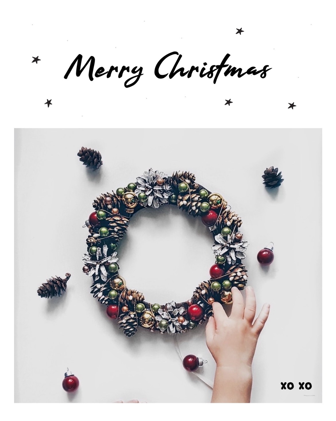 A Person Holding A Christmas Wreath With Pine Cones Merry Christmas Template