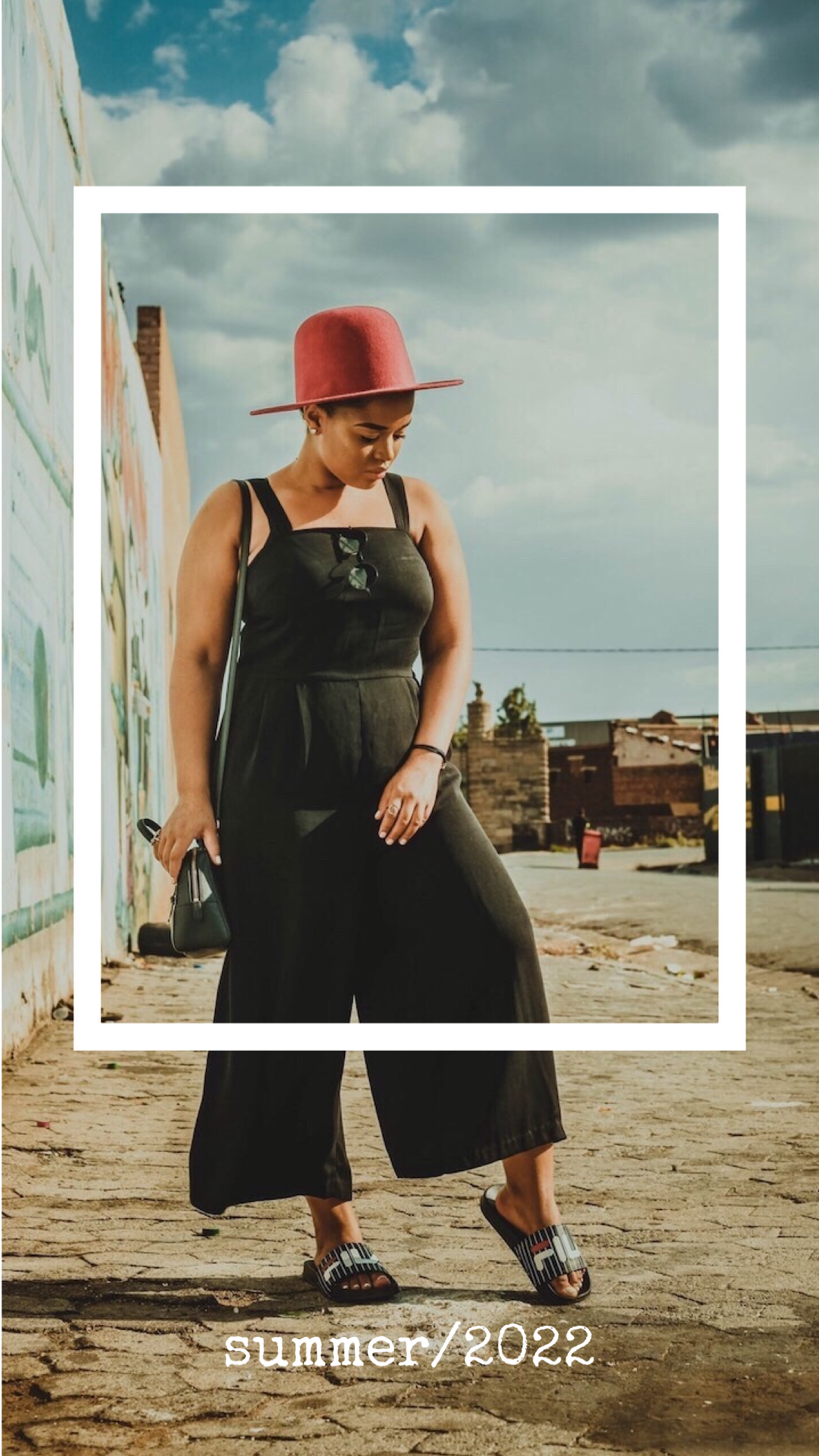 A Woman Wearing A Red Hat And Black Jumpsuit Classy Template