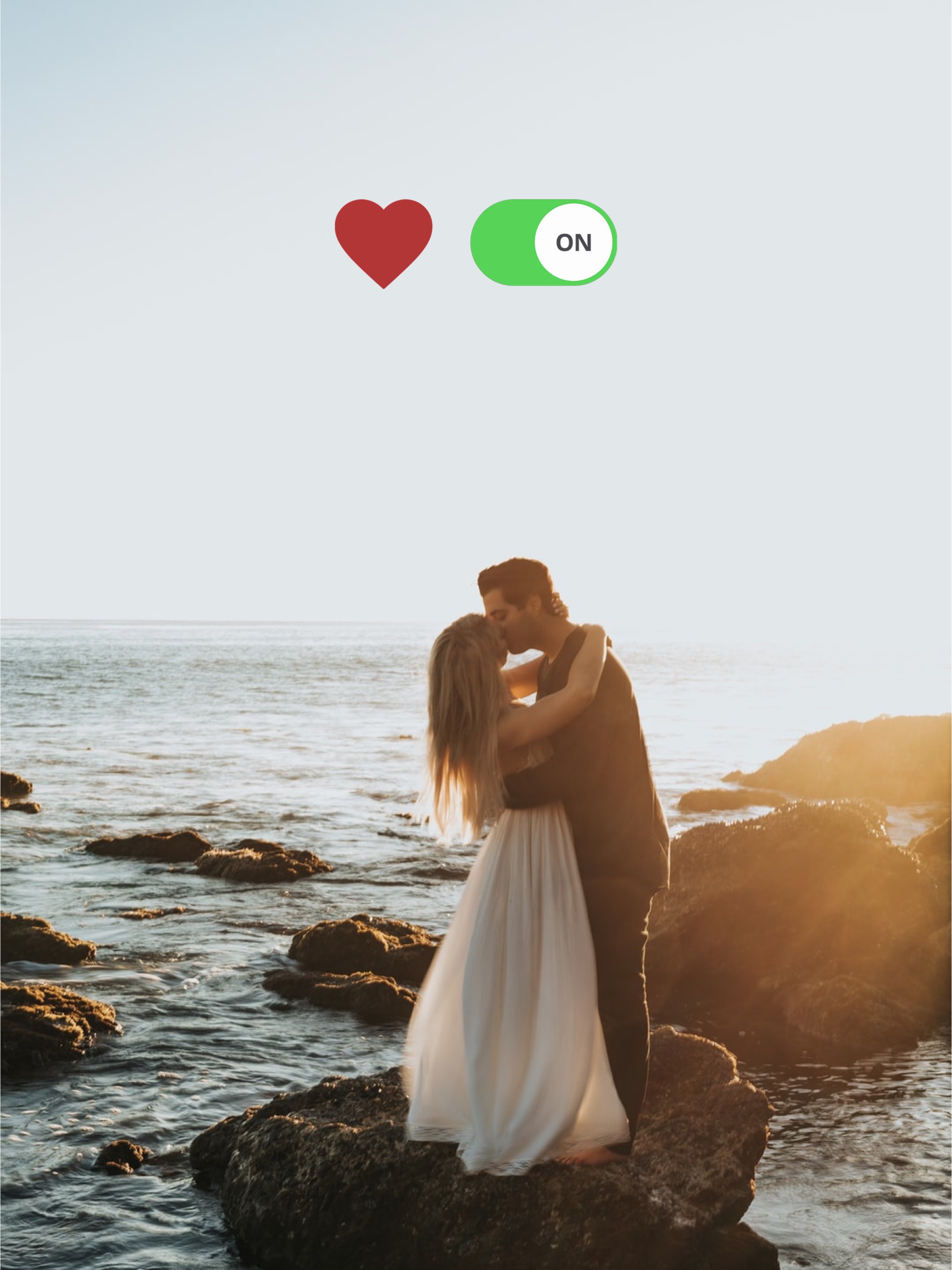 A Man And A Woman Kissing On A Rock Near The Ocean Notifications Template