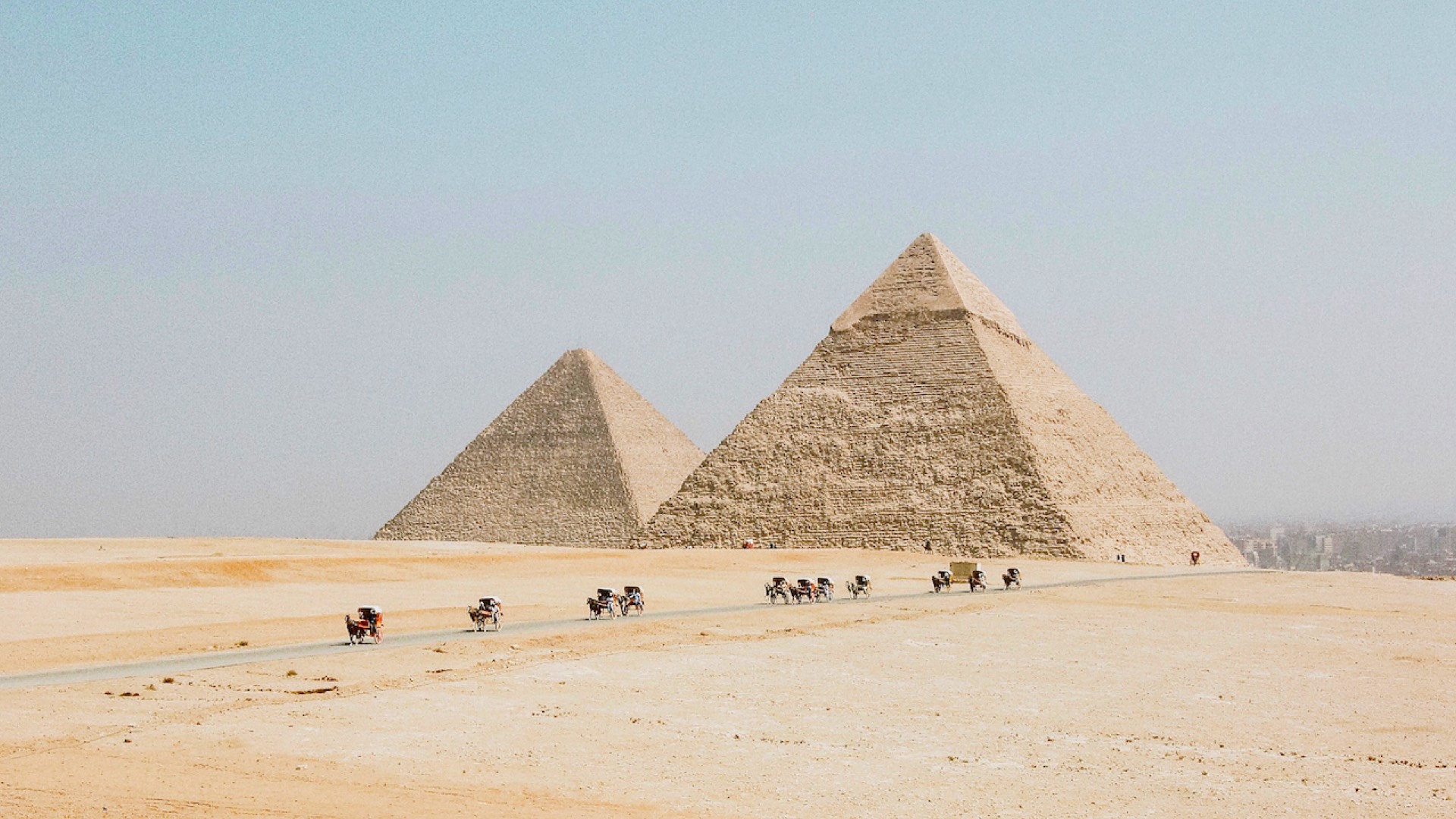 A Group Of People Riding Horses In Front Of Three Pyramids Zoom Backgrounds Template