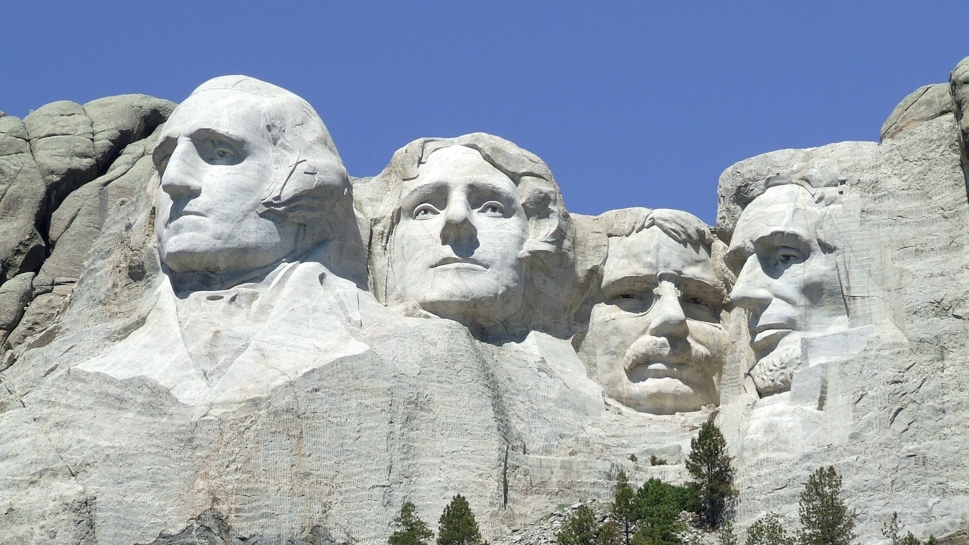 A Group Of Presidents Carved Into The Side Of A Mountain Zoom Backgrounds Template